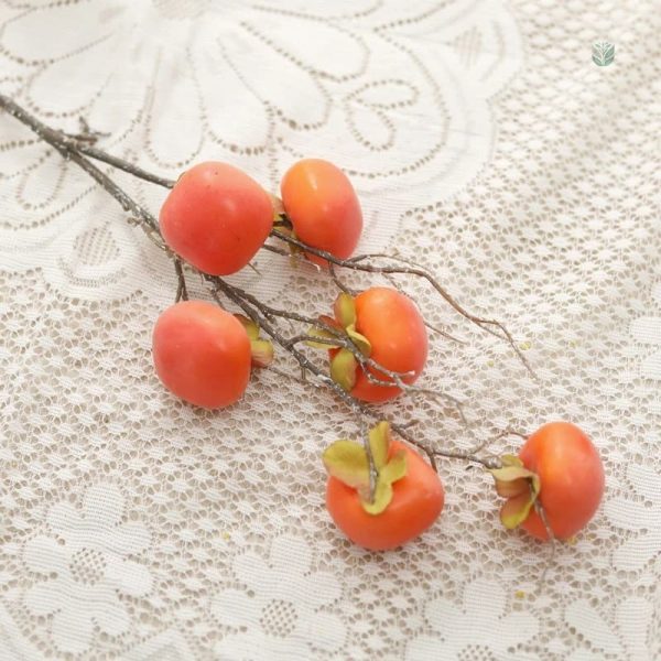 Branche artificielle avec fruits de kaki