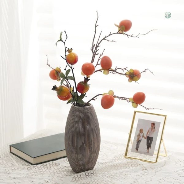 Branche de fruit kaki pour embellissement d'espace