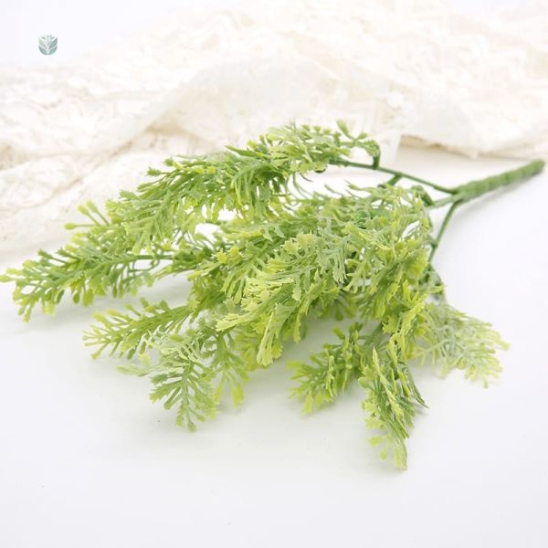 Branche artificielle avec feuillage luxuriant