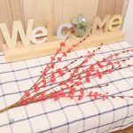 Branche artificielle avec fleurs réalistes
