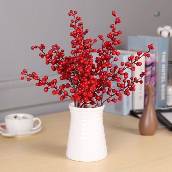 Détails de décoration en branches de baies rouges