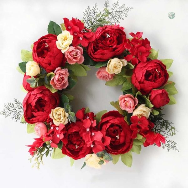 Couronne de fleurs avec pivoines en rose doux
