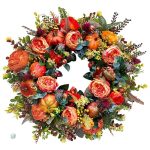 Couronne automnale avec fleurs et citrouilles colorées