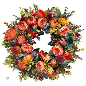 Couronne automnale avec fleurs et citrouilles colorées