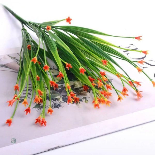 Arrangement de fleurs synthétiques pour un look frais